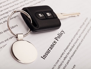 image of car keys and auto insurance policy